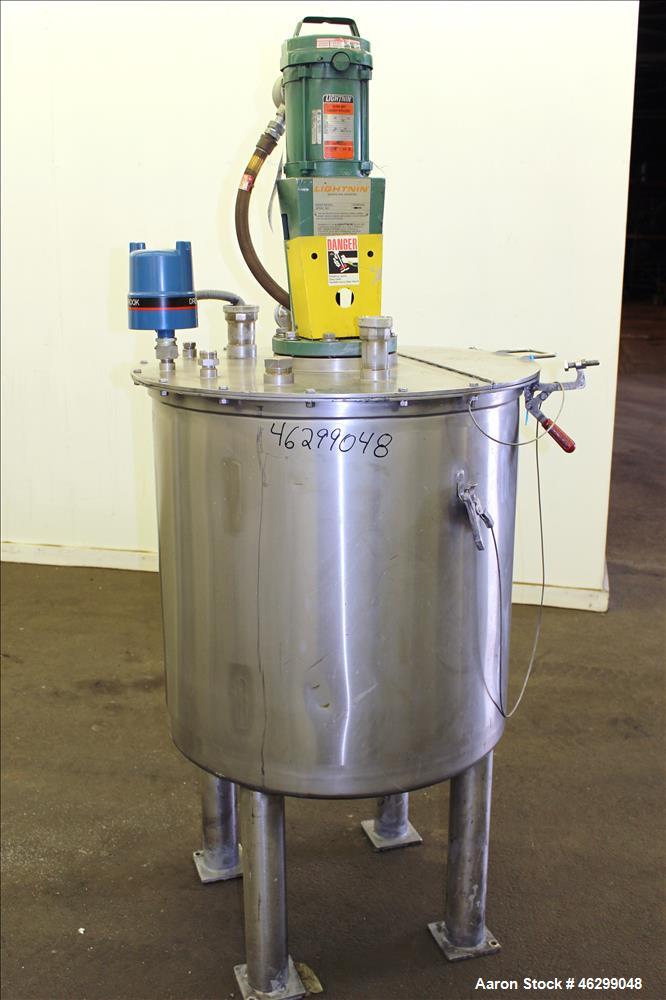Used Tank, Approximately 80 Gallons, 304 Stainless Steel, Vertical. 30" Diameter x 28" straight side. Bolt-on flat top with 1/3 hinged cover, dished bottom. Top entering Lightnin agitator model XJC-3...