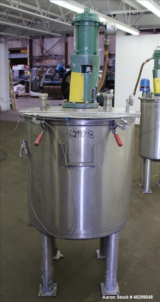 Used Tank, Approximately 80 Gallons, 304 Stainless Steel, Vertical. 30" Diameter x 28" straight side. Bolt-on flat top with 1/3 hinged cover, dished bottom. Top entering Lightnin agitator model XJC-3...
