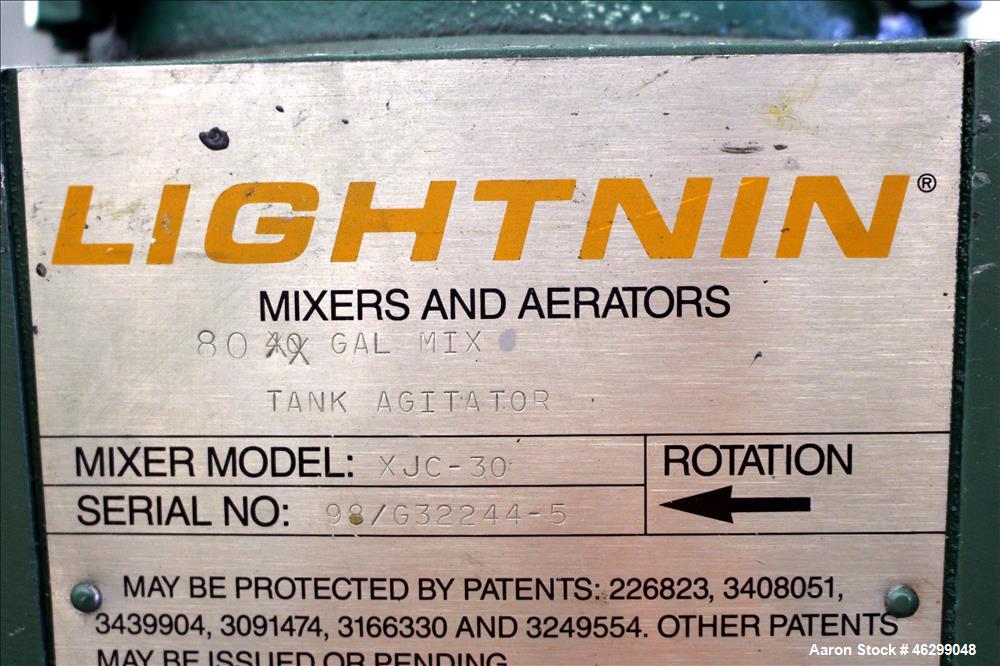 Used Tank, Approximately 80 Gallons, 304 Stainless Steel, Vertical. 30" Diameter x 28" straight side. Bolt-on flat top with 1/3 hinged cover, dished bottom. Top entering Lightnin agitator model XJC-3...
