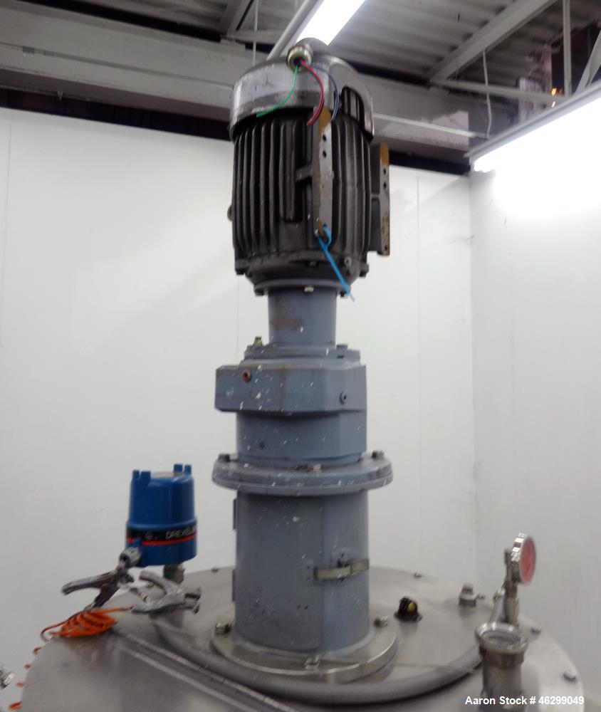 Used Tank, Approximately 80 Gallons, 304 Stainless Steel, Vertical. 30" Diameter x 28" straight side. Bolt-on flat top with 1/3 hinged cover, dished bottom. Top entering agitator, with 2" diameter sh...
