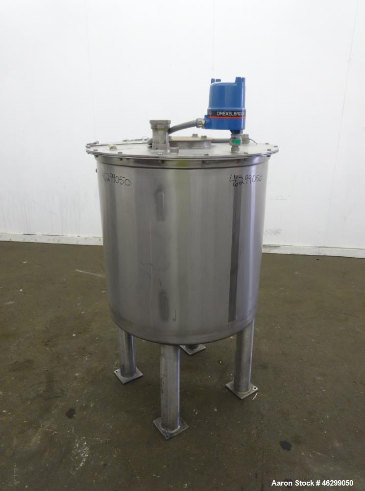 Used Tank, Approximately 80 Gallons, 304 Stainless Steel, Vertical. 30" Diameter x 28" straight side. Bolt-on flat top with 1/3 hinged cover, dished bottom. (4) Sidewall baffles. 1-1/2" Tri-clamp cen...