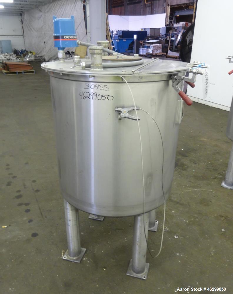 Used Tank, Approximately 80 Gallons, 304 Stainless Steel, Vertical. 30" Diameter x 28" straight side. Bolt-on flat top with 1/3 hinged cover, dished bottom. (4) Sidewall baffles. 1-1/2" Tri-clamp cen...