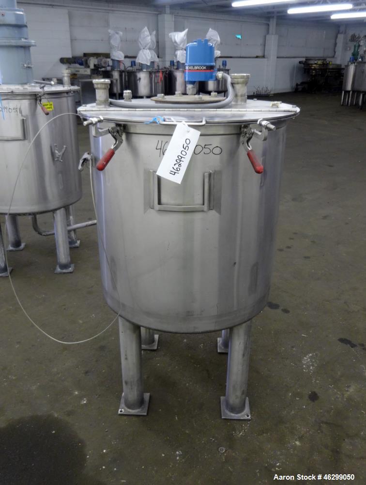 Used Tank, Approximately 80 Gallons, 304 Stainless Steel, Vertical. 30" Diameter x 28" straight side. Bolt-on flat top with 1/3 hinged cover, dished bottom. (4) Sidewall baffles. 1-1/2" Tri-clamp cen...
