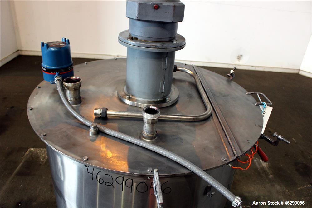 Used Tank, Approximately 120 Gallons, 304 Stainless Steel, Vertical. 40" Diameter x 22" straight side. Bolt-on flat top with 1/4 hinged cover, dished bottom. Top entering agitator, with 2" diameter s...