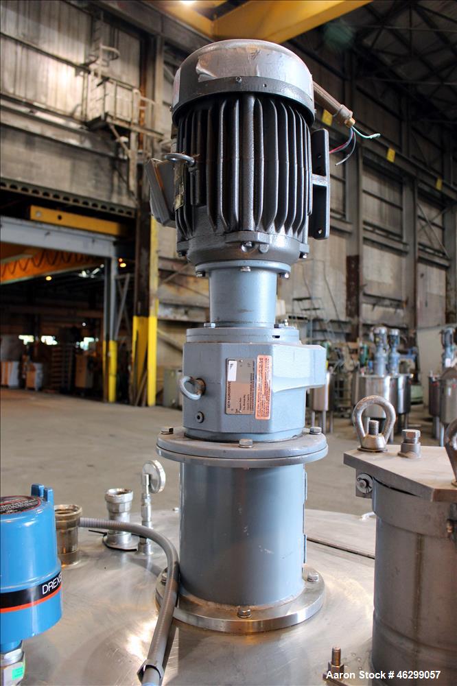 Used Tank, Approximately 120 Gallons, 304 Stainless Steel, Vertical. 40" Diameter x 22" straight side. Bolt-on flat top with 1/4 hinged cover, dished bottom. Top entering agitator, with 2" diameter s...