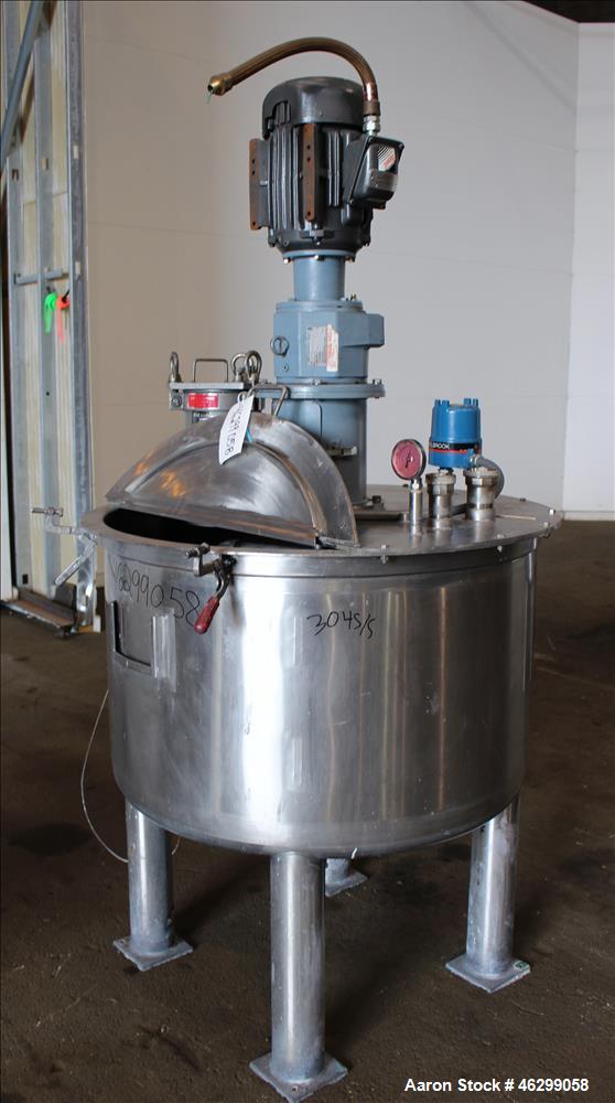 Used Tank, Approximately 120 Gallons, 304 Stainless Steel, Vertical. 40" Diameter x 22" straight side. Bolt-on flat top with 1/4 hinged cover, dished bottom. Top entering agitator, with 2" diameter s...