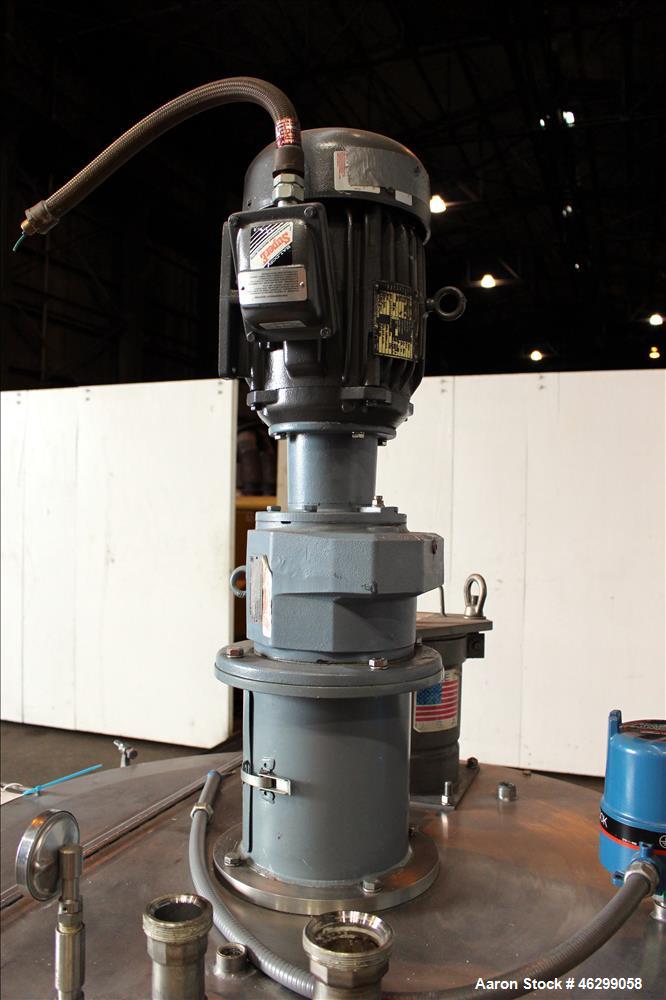 Used Tank, Approximately 120 Gallons, 304 Stainless Steel, Vertical. 40" Diameter x 22" straight side. Bolt-on flat top with 1/4 hinged cover, dished bottom. Top entering agitator, with 2" diameter s...