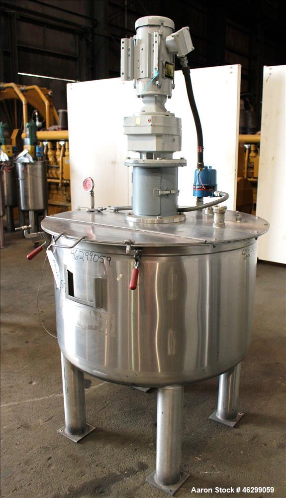 Used Tank, Approximately 120 Gallons, 304 Stainless Steel, Vertical. 40" Diameter x 22" straight side. Bolt-on flat top with 1/4 hinged cover, dished bottom. Top entering agitator, with 2" diameter s...