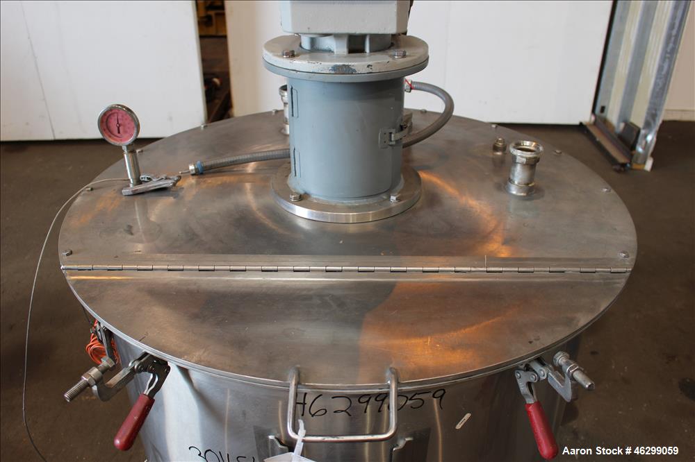 Used Tank, Approximately 120 Gallons, 304 Stainless Steel, Vertical. 40" Diameter x 22" straight side. Bolt-on flat top with 1/4 hinged cover, dished bottom. Top entering agitator, with 2" diameter s...