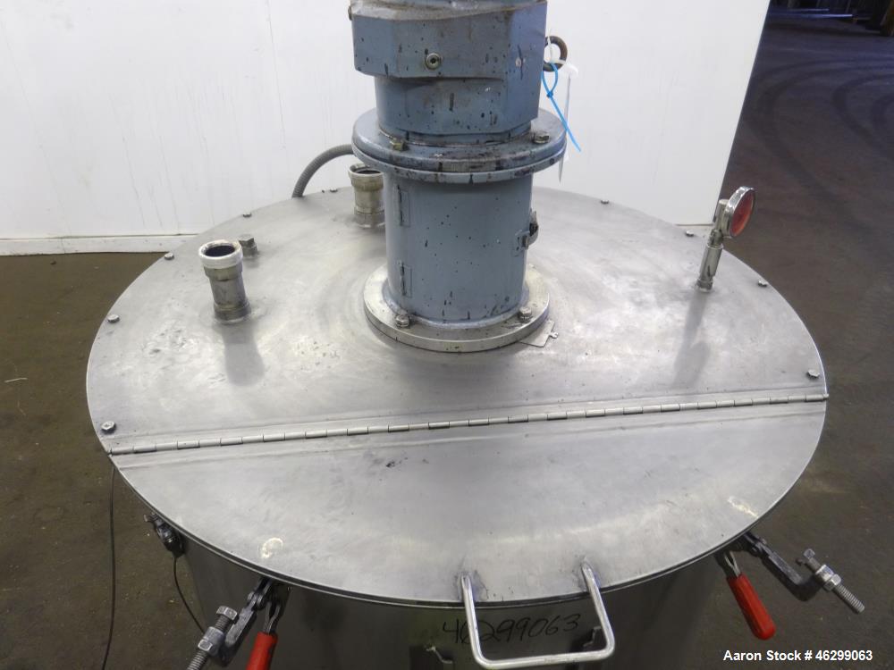 Used Tank, Approximately 120 Gallons, 304 Stainless Steel, Vertical. 40" Diameter x 22" straight side. Bolt-on flat top with 1/4 hinged cover, dished bottom. Top entering agitator, with 2" diameter s...