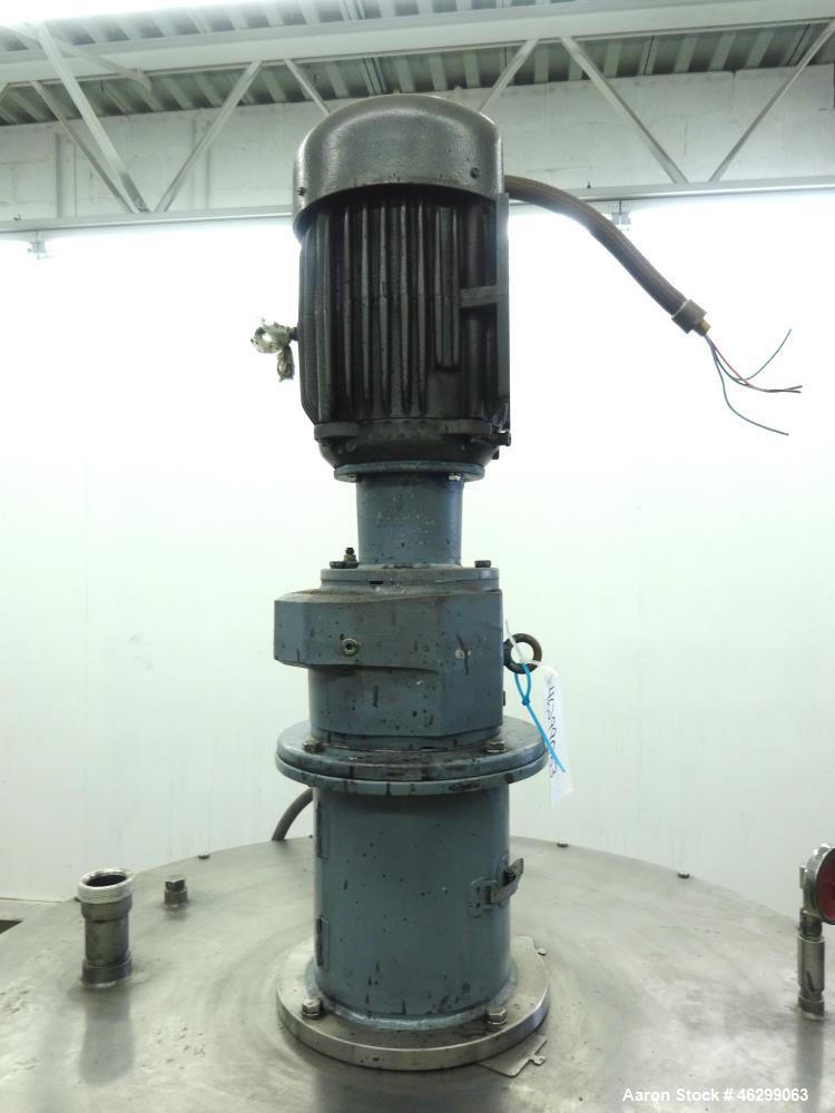 Used Tank, Approximately 120 Gallons, 304 Stainless Steel, Vertical. 40" Diameter x 22" straight side. Bolt-on flat top with 1/4 hinged cover, dished bottom. Top entering agitator, with 2" diameter s...