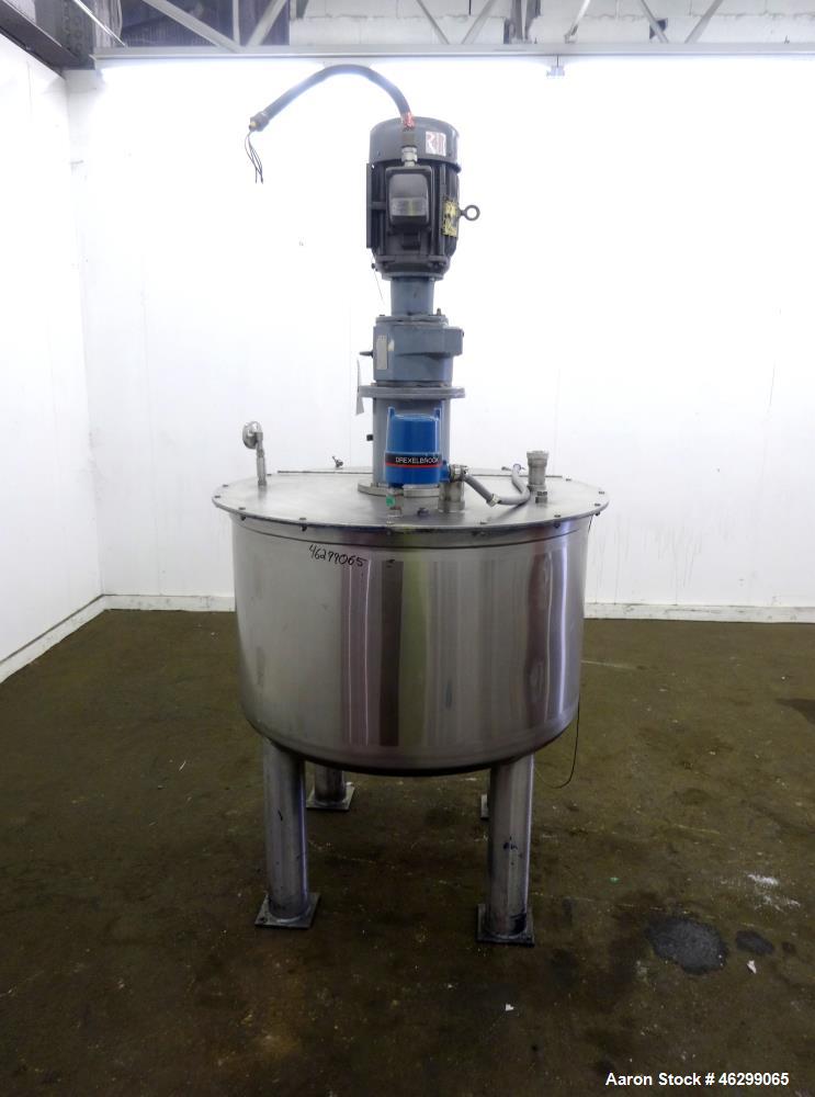 Used Tank, Approximately 120 Gallons, 304 Stainless Steel, Vertical. 40" Diameter x 22" straight side. Bolt-on flat top with 1/4 hinged cover, dished bottom. Top entering agitator, with 2" diameter s...