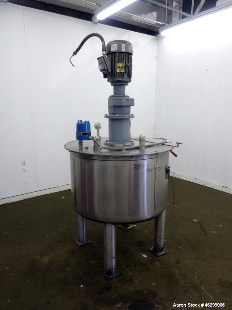 Used Tank, Approximately 120 Gallons, 304 Stainless Steel, Vertical. 40" Diameter x 22" straight side. Bolt-on flat top with 1/4 hinged cover, dished bottom. Top entering agitator, with 2" diameter s...
