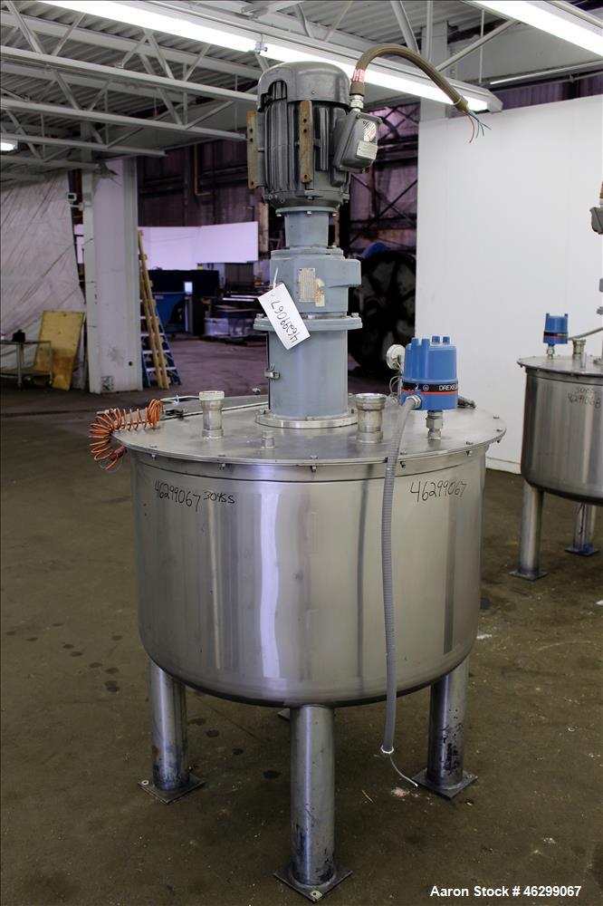 Used Tank, Approximately 120 Gallons, 304 Stainless Steel, Vertical. 40" Diameter x 22" straight side. Bolt-on flat top with 1/4 hinged cover, dished bottom. Top entering agitator, with 2" diameter s...
