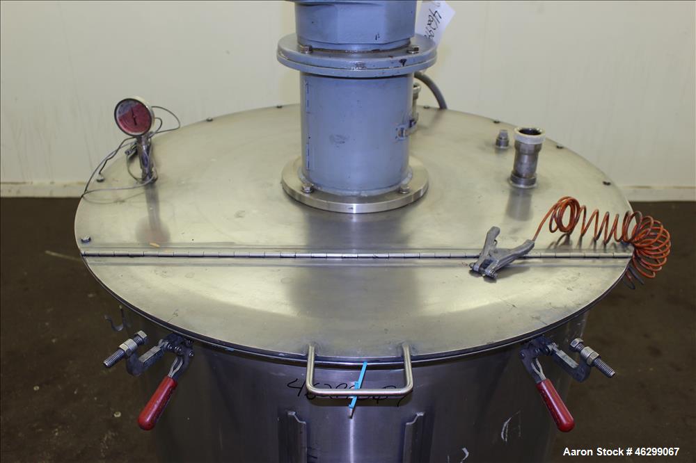 Used Tank, Approximately 120 Gallons, 304 Stainless Steel, Vertical. 40" Diameter x 22" straight side. Bolt-on flat top with 1/4 hinged cover, dished bottom. Top entering agitator, with 2" diameter s...