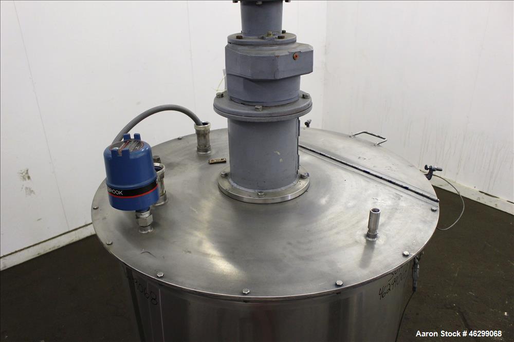 Used Tank, Approximately 120 Gallons, 304 Stainless Steel, Vertical. 40" Diameter x 22" straight side. Bolt-on flat top with 1/4 hinged cover, dished bottom. Top entering agitator, with 2" diameter s...
