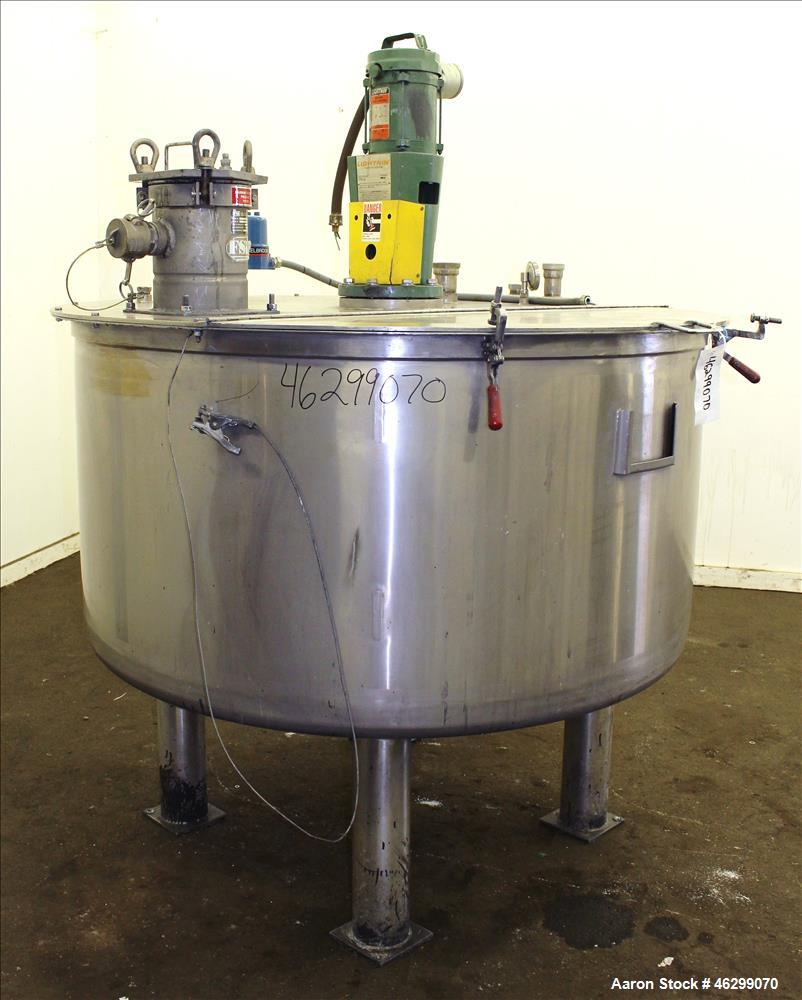 Used Tank, Approximately 350 Gallons, 304 Stainless Steel, Vertical. 60" Diameter x 28" straight side. Bolt-on flat top with 1/3 hinged cover, dished bottom. Top entering Lightnin agitator, model XJC...