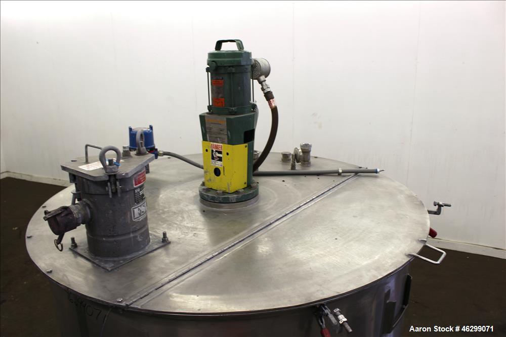 Used Tank, Approximately 350 Gallons, 304 Stainless Steel, Vertical. 60" Diameter x 28" straight side. Bolt-on flat top with 1/3 hinged cover, dished bottom. Top entering Lightnin agitator, model XJC...