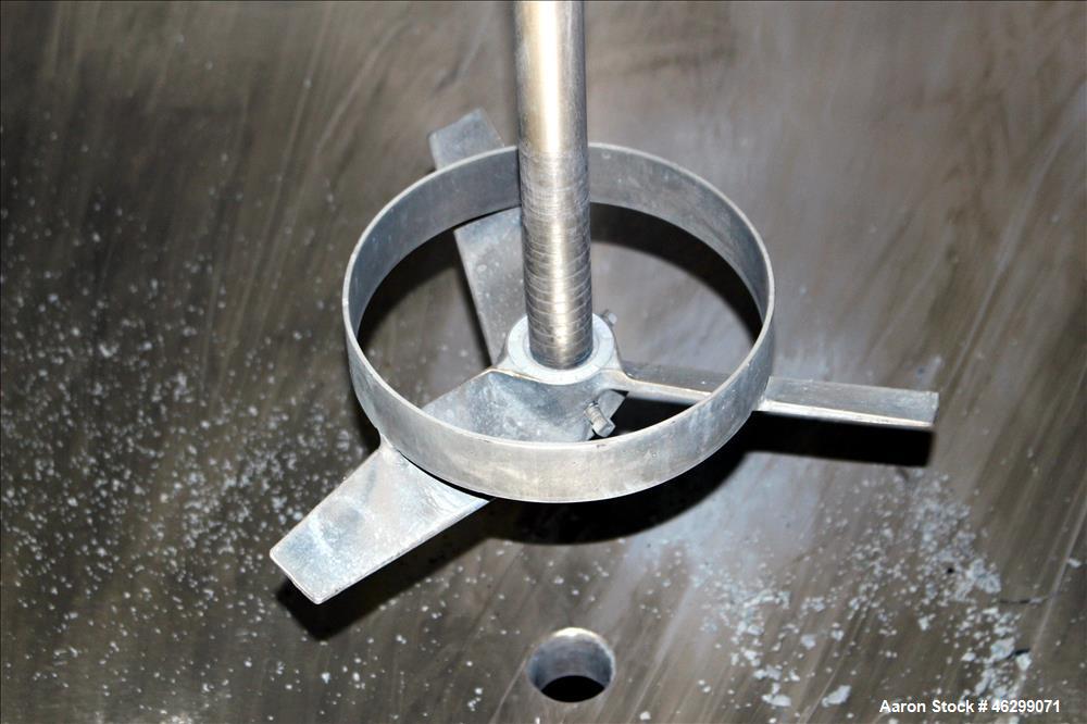 Used Tank, Approximately 350 Gallons, 304 Stainless Steel, Vertical. 60" Diameter x 28" straight side. Bolt-on flat top with 1/3 hinged cover, dished bottom. Top entering Lightnin agitator, model XJC...
