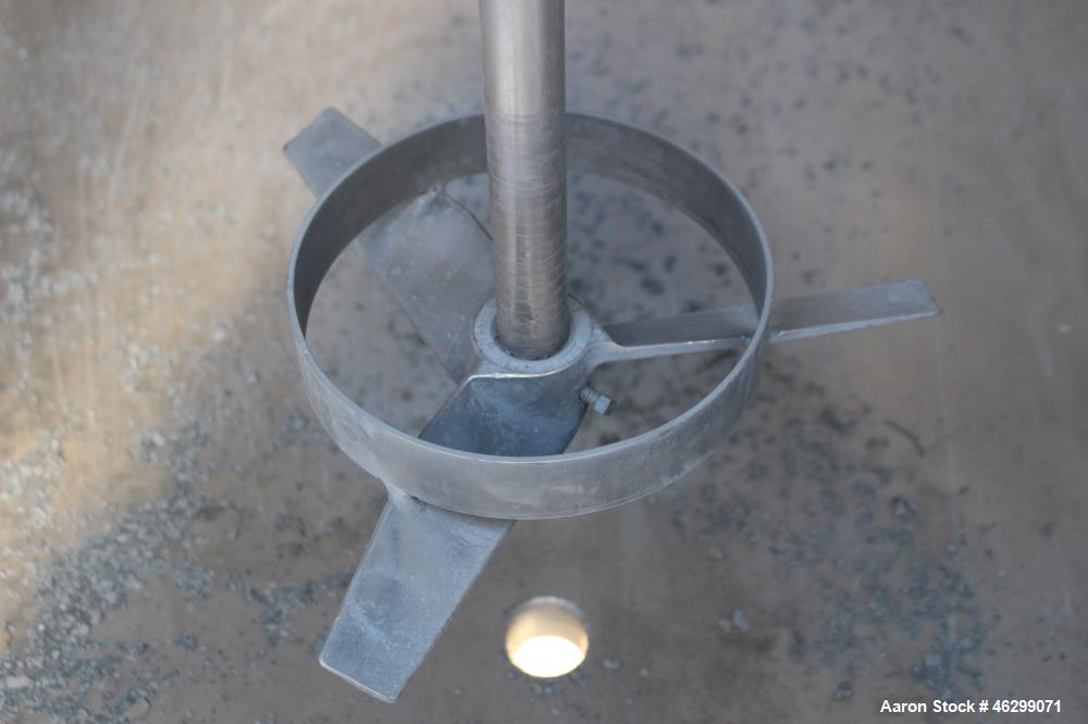 Used Tank, Approximately 350 Gallons, 304 Stainless Steel, Vertical. 60" Diameter x 28" straight side. Bolt-on flat top with 1/3 hinged cover, dished bottom. Top entering Lightnin agitator, model XJC...