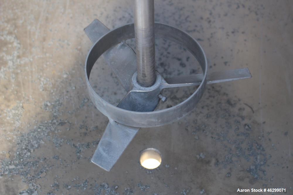 Used Tank, Approximately 350 Gallons, 304 Stainless Steel, Vertical. 60" Diameter x 28" straight side. Bolt-on flat top with 1/3 hinged cover, dished bottom. Top entering Lightnin agitator, model XJC...