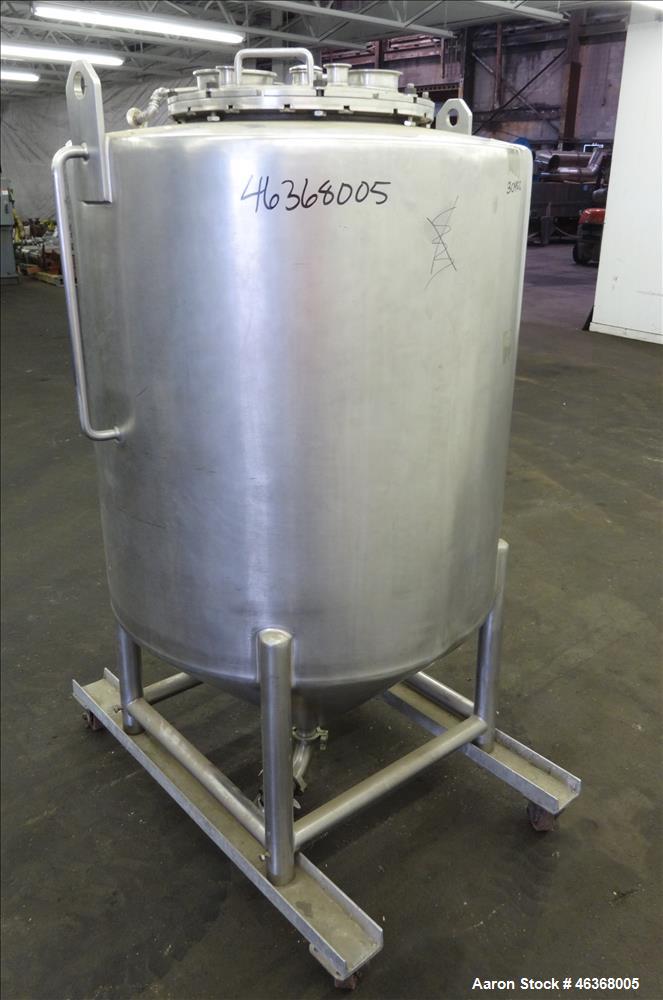 Used Tank, Approximate 200 Gallon, 304 Stainless Steel, Vertical. Approximate 35" diameter x 37" straight side. Slight dished top and 24" long coned bottom. Openings top: 18" diameter bolt on cover w...