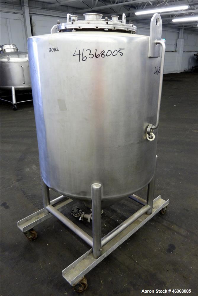Used Tank, Approximate 200 Gallon, 304 Stainless Steel, Vertical. Approximate 35" diameter x 37" straight side. Slight dished top and 24" long coned bottom. Openings top: 18" diameter bolt on cover w...