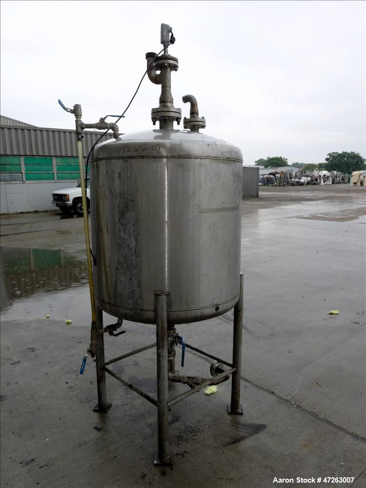 Used Tank, Approximate 150 Gallon, 304 Stainless Steel, Vertical. Approximate 38" diameter x 32" straight side, dished top and bottom. Top openings: 3", 2", 1". 1.5" Center bottom outlet. Mounted on ...
