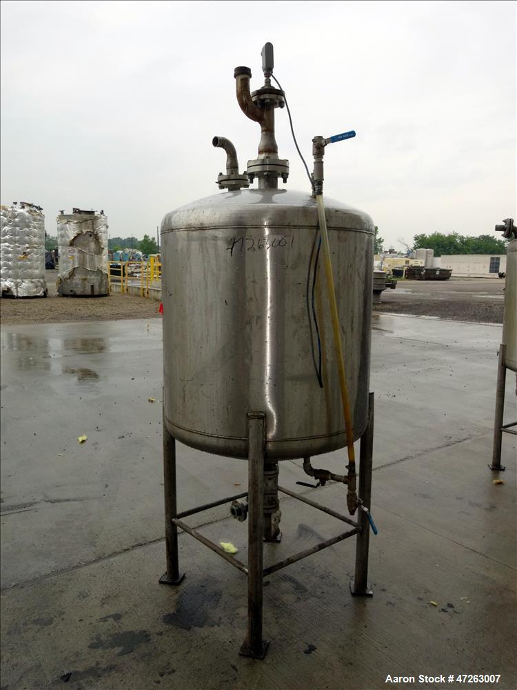 Used Tank, Approximate 150 Gallon, 304 Stainless Steel, Vertical. Approximate 38" diameter x 32" straight side, dished top and bottom. Top openings: 3", 2", 1". 1.5" Center bottom outlet. Mounted on ...