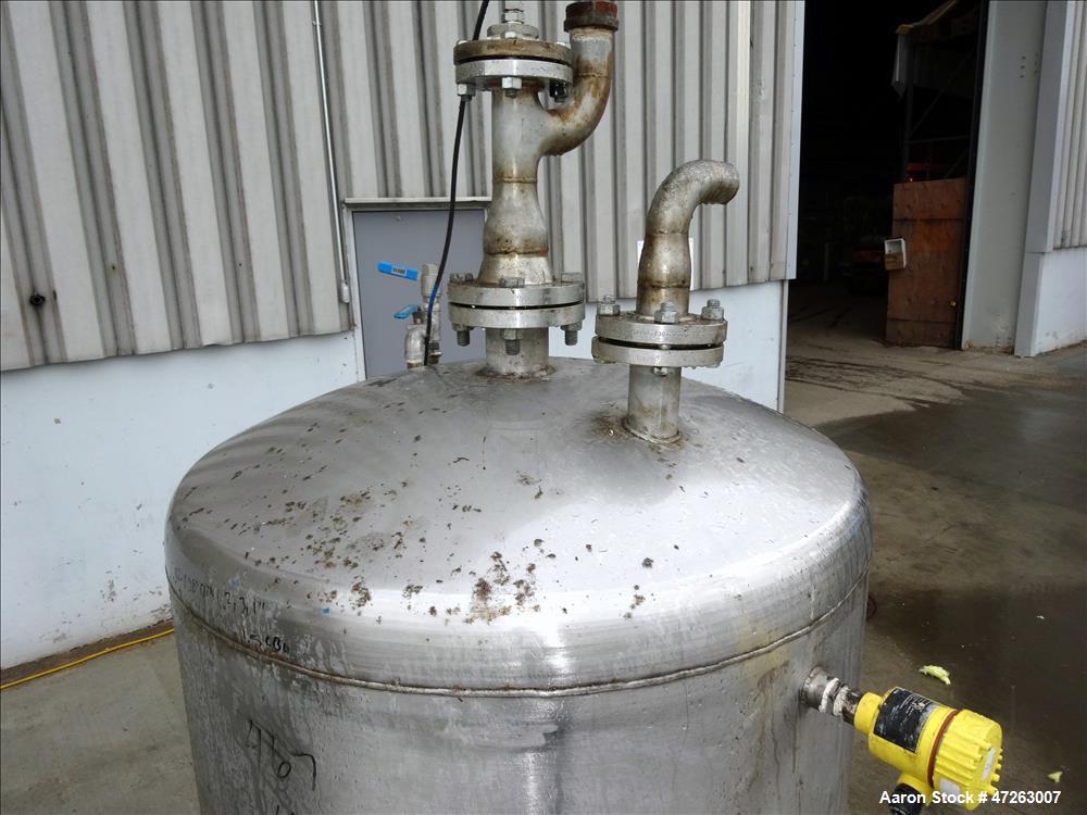 Used Tank, Approximate 150 Gallon, 304 Stainless Steel, Vertical. Approximate 38" diameter x 32" straight side, dished top and bottom. Top openings: 3", 2", 1". 1.5" Center bottom outlet. Mounted on ...
