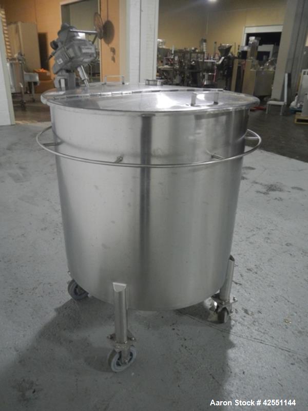 Used Lee tank, 130 gallon, model 500LDBT, stainless steel construction, approximately 36" diameter x 36" straight side, open top, flat slopping bottom, 2" center bottom outlet with clamp on Chemineer...