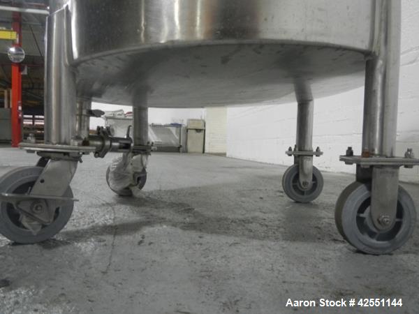 Used Lee tank, 130 gallon, model 500LDBT, stainless steel construction, approximately 36" diameter x 36" straight side, open top, flat slopping bottom, 2" center bottom outlet with clamp on Chemineer...