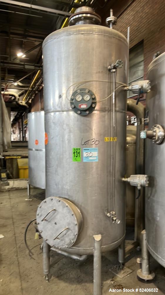 Used Tank, Approximate 250 Gallon, Stainless Steel, Vertical. Approximate 30" diameter x 77" straight side, dished top & bottom. Mounted on 4 stainless legs.