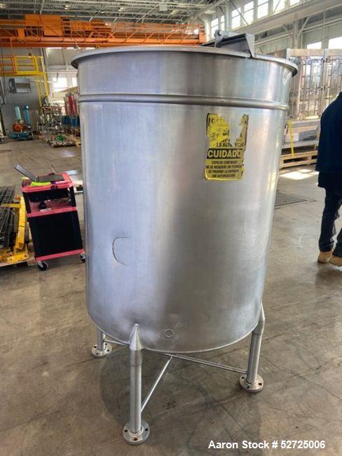 Used- Stainless Steel Tank, Approximate 100 Gallon, Stainless Steel, Vertical. Flat top, pitched bottom. Bottom outlet. Moun...