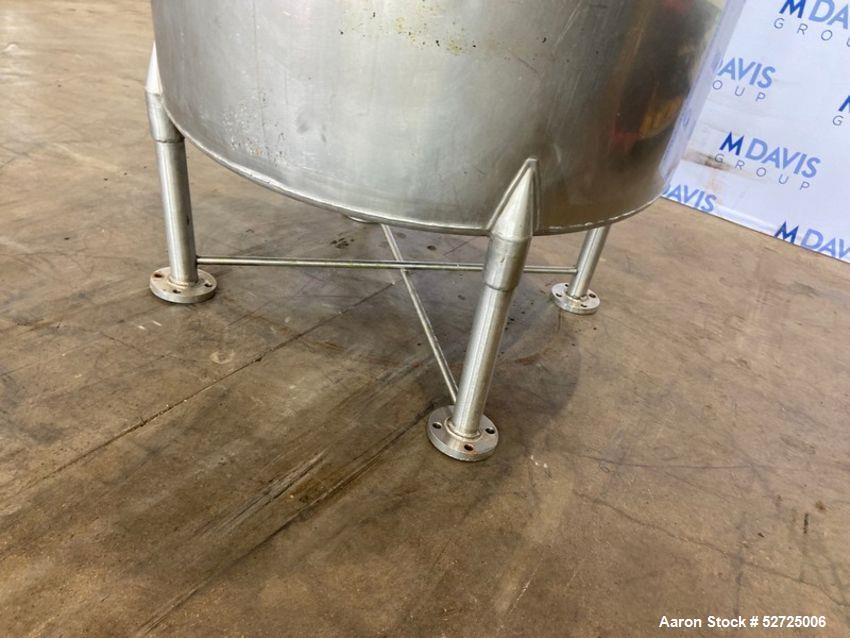 Used- Stainless Steel Tank, Approximate 100 Gallon, Stainless Steel, Vertical. Flat top, pitched bottom. Bottom outlet. Moun...