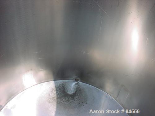 USED: Tank, 300 gallon, stainless steel, vertical. 44" diameter x 48" straight side. Open top, flat bottom. Mounted on four casters.
