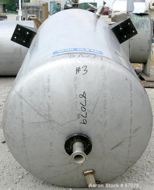 USED: Tank, 275 gallon, 304 stainless steel, vertical. Approximate 36" diameter x 60" straight side. Flat top, dish bottom. Openings: top (3) 2", (2) 3"; 2" center bottom outlet. (4) Side lug mounts.