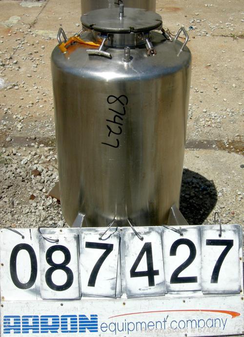 USED: Tank, 25 gallon, 304 stainless steel, vertical. 18" diameter x 24" straight side, dish top and bottom. Openings: top (2) 1/2", 7" with cover; 5/8" center bottom outlet. Mounted on 4 stainless s...