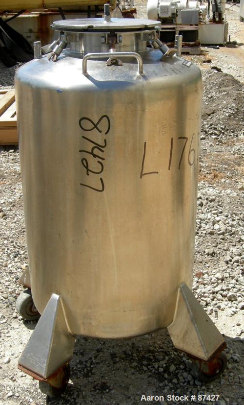 USED: Tank, 25 gallon, 304 stainless steel, vertical. 18" diameter x 24" straight side, dish top and bottom. Openings: top (2) 1/2", 7" with cover; 5/8" center bottom outlet. Mounted on 4 stainless s...