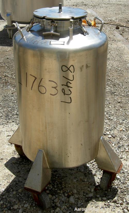 USED: Tank, 25 gallon, 304 stainless steel, vertical. 18" diameter x 24" straight side, dish top and bottom. Openings: top (2) 1/2", 7" with cover; 5/8" center bottom outlet. Mounted on 4 stainless s...