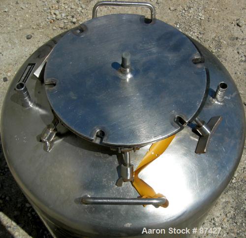 USED: Tank, 25 gallon, 304 stainless steel, vertical. 18" diameter x 24" straight side, dish top and bottom. Openings: top (2) 1/2", 7" with cover; 5/8" center bottom outlet. Mounted on 4 stainless s...