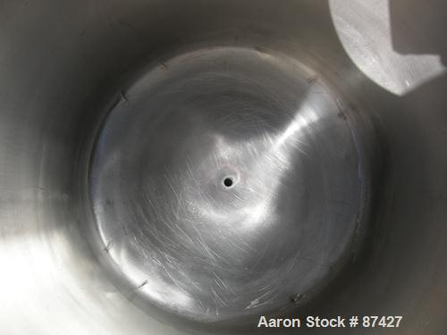 USED: Tank, 25 gallon, 304 stainless steel, vertical. 18" diameter x 24" straight side, dish top and bottom. Openings: top (2) 1/2", 7" with cover; 5/8" center bottom outlet. Mounted on 4 stainless s...