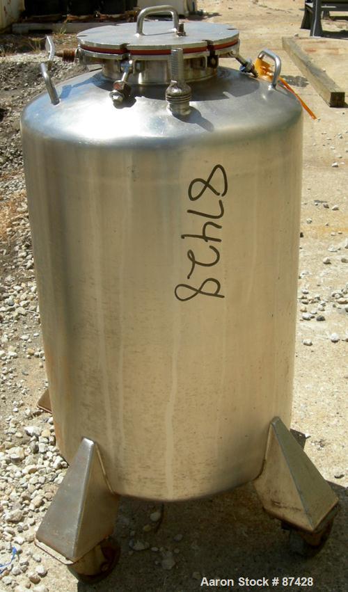 USED: Tank, 25 gallon, 304 stainless steel, vertical. 18" diameter x 24" straight side, dish top and bottom. Openings: top (2) 1/2", 7" with cover; 5/8" NPT center bottom outlet. Mounted on 4 stainle...