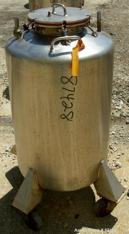 USED: Tank, 25 gallon, 304 stainless steel, vertical. 18" diameter x 24" straight side, dish top and bottom. Openings: top (2) 1/2", 7" with cover; 5/8" NPT center bottom outlet. Mounted on 4 stainle...