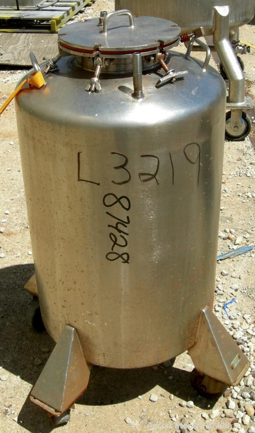 USED: Tank, 25 gallon, 304 stainless steel, vertical. 18" diameter x 24" straight side, dish top and bottom. Openings: top (2) 1/2", 7" with cover; 5/8" NPT center bottom outlet. Mounted on 4 stainle...