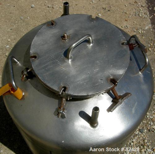 USED: Tank, 25 gallon, 304 stainless steel, vertical. 18" diameter x 24" straight side, dish top and bottom. Openings: top (2) 1/2", 7" with cover; 5/8" NPT center bottom outlet. Mounted on 4 stainle...