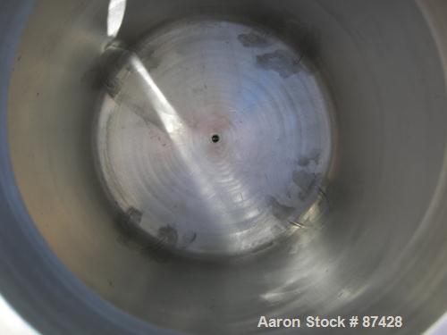 USED: Tank, 25 gallon, 304 stainless steel, vertical. 18" diameter x 24" straight side, dish top and bottom. Openings: top (2) 1/2", 7" with cover; 5/8" NPT center bottom outlet. Mounted on 4 stainle...
