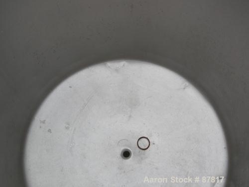 USED: Tank, 100 gallon, 304 stainless steel, vertical. 30" diameter X 30" straight side, open top, no cover, dish bottom. 1" center bottom outlet. Mounted on 3 carbon steel legs with casters.
