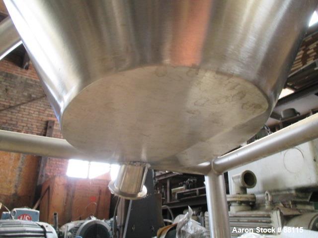 Used Tank, 20 Gallon, Stainless Steel, Vertical. 21" Diameter x 11" straight side x 12" coned bottom, flat top. 1" off center bottom outlet. Mounted on 4 legs with casters.