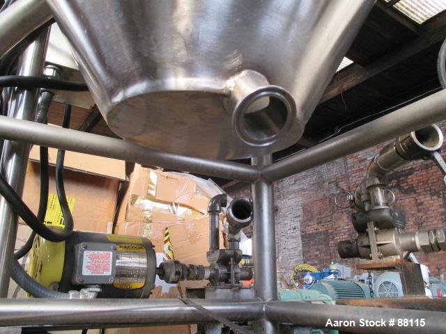 Used Tank, 20 Gallon, Stainless Steel, Vertical. 21" Diameter x 11" straight side x 12" coned bottom, flat top. 1" off center bottom outlet. Mounted on 4 legs with casters.